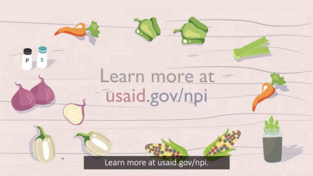 Fundraising cartoon still showing vegetables around the phrase “Learn More at usaid.gov”