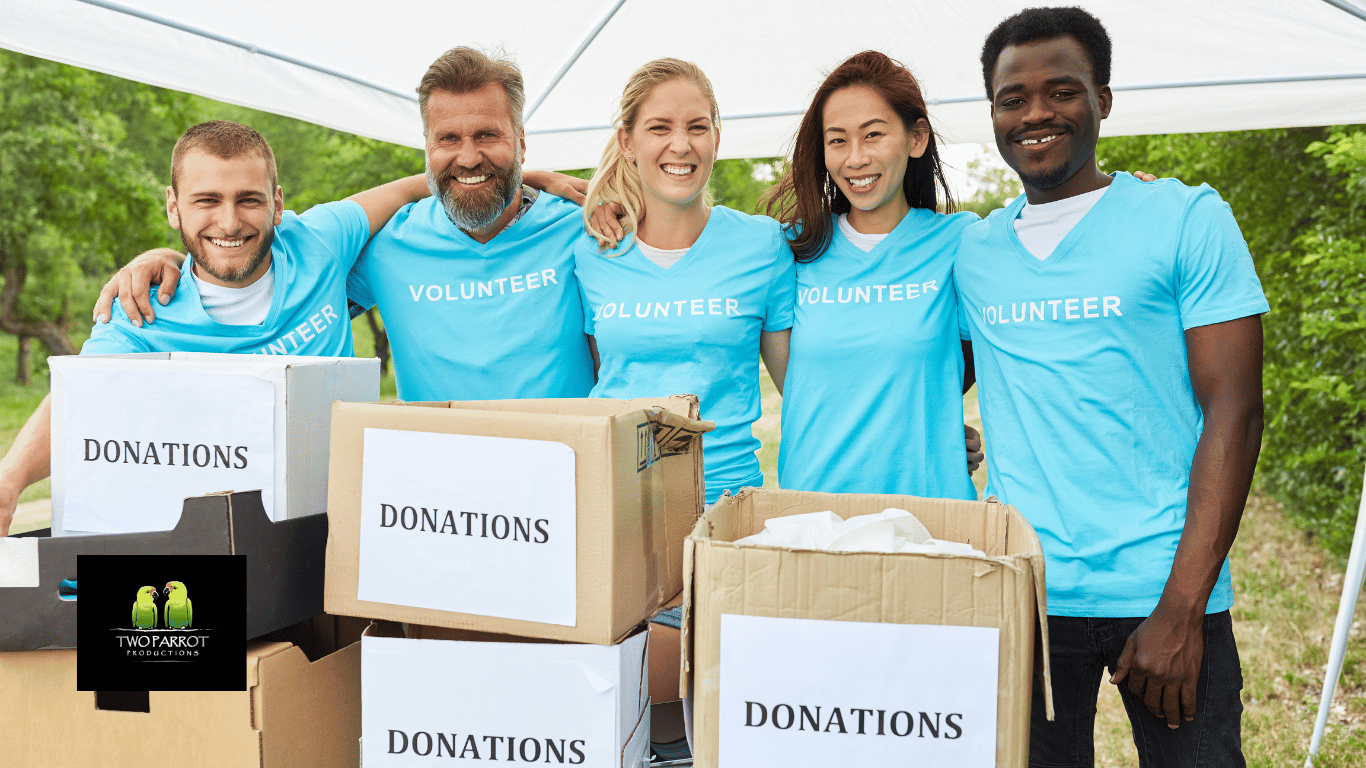 An image showing a group of people holding hands and smiling while fundraising